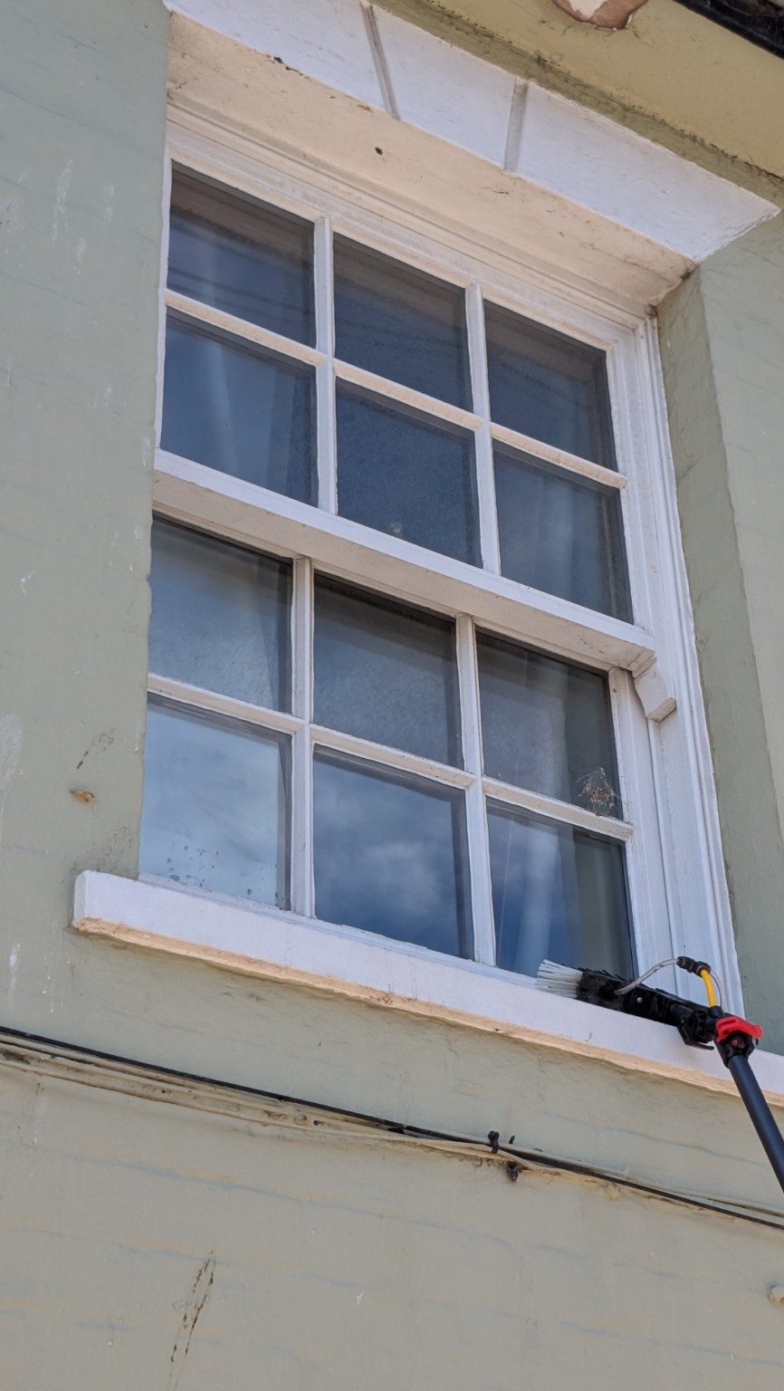 Water-fed pole cleaning at a Southwold holiday flat
