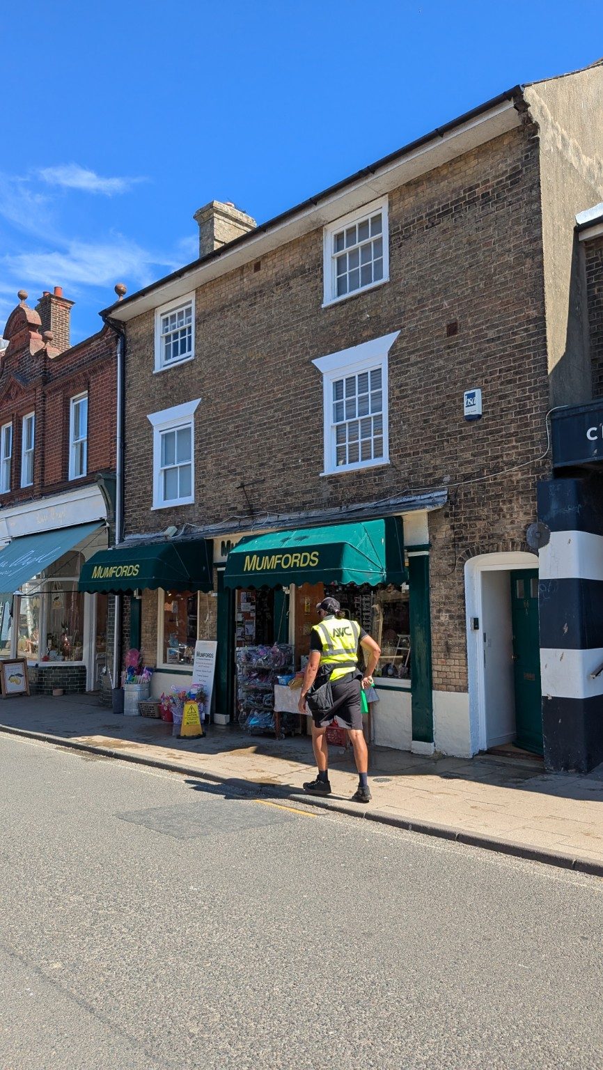 Upper floor flat window cleaning above a shop in Southwold Suffolk